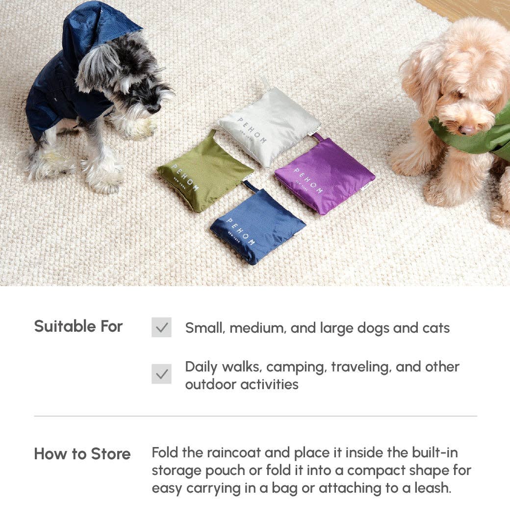 Two dogs wearing raincoats with folded raincoats and storage pouches on a carpeted floor.